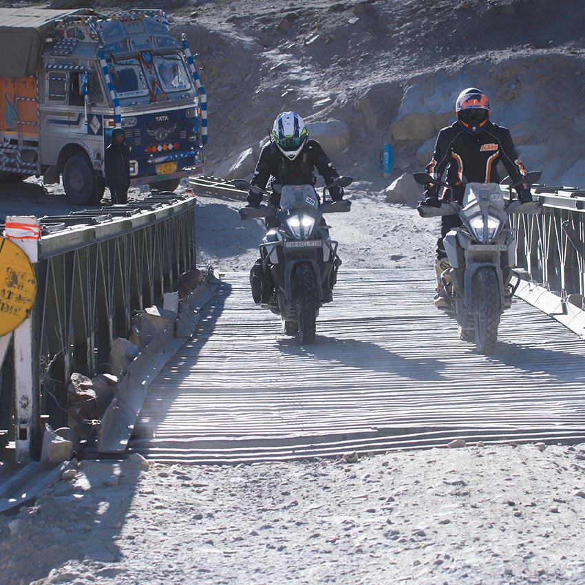 KTM Adventure 390 rider in ladakh crossing the bridge